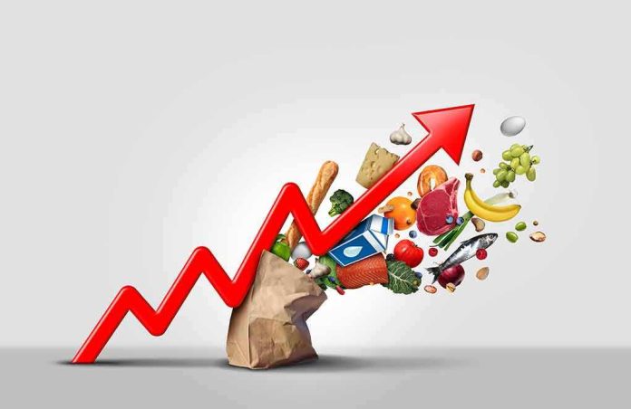 Red upward arrow over groceries spilling from a paper bag
