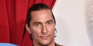 Matthew McConaughey at an event, close-up portrait in a brown suit