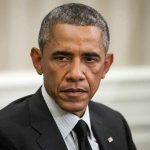 Obama Insider Blames RACISM for Today’s Divide Man in suit looking to the side, identified as Rob Nabors