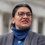 Rashida Tlaib Caught on HIDDEN Camera woman in glasses speaking outdoors
