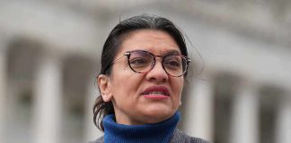 Rashida Tlaib Caught on HIDDEN Camera woman in glasses speaking outdoors