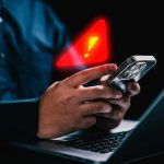 Nolan Wells Fallout Takes a SINISTER Turn hands holding smartphone with warning alert icon