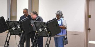 Lester Bowie and Miriam Tlali using electronic voting machines at a polling place